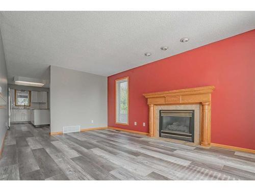 9110 136 Ave, Peace River, AB - Indoor Photo Showing Living Room With Fireplace