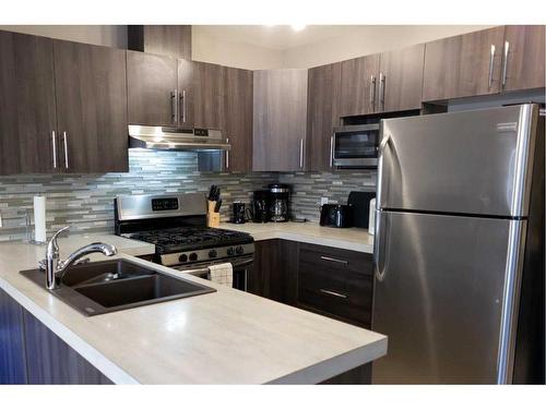 11322 105 Avenue, Grande Prairie, AB - Indoor Photo Showing Kitchen With Double Sink With Upgraded Kitchen