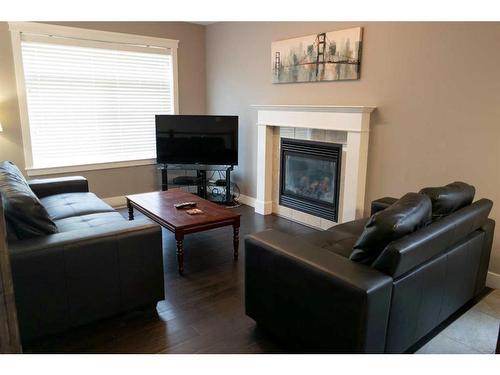 11322 105 Avenue, Grande Prairie, AB - Indoor Photo Showing Living Room With Fireplace