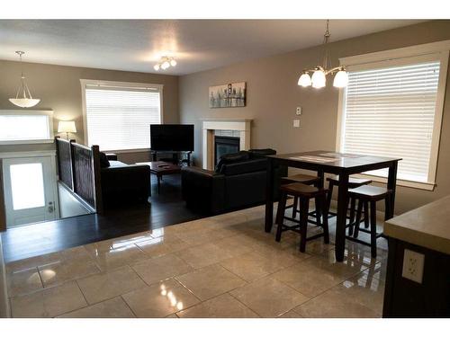 11322 105 Avenue, Grande Prairie, AB - Indoor Photo Showing Dining Room With Fireplace