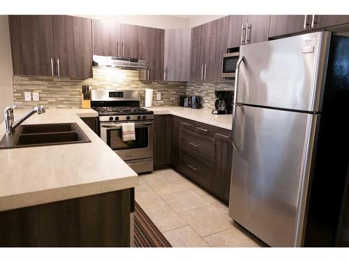 11322 105 Avenue, Grande Prairie, AB - Indoor Photo Showing Kitchen With Double Sink With Upgraded Kitchen