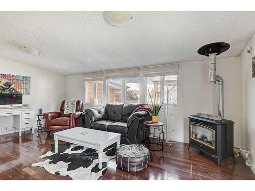 11307 103 Street, Grande Prairie, AB - Indoor Photo Showing Living Room With Fireplace