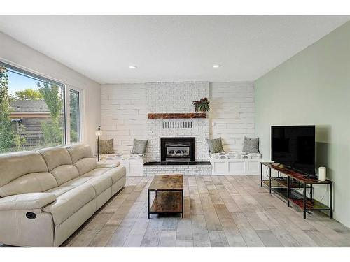 9505 78 Avenue, Grande Prairie, AB - Indoor Photo Showing Living Room With Fireplace