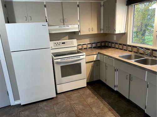 8222 96 Street, Peace River, AB - Indoor Photo Showing Kitchen With Double Sink