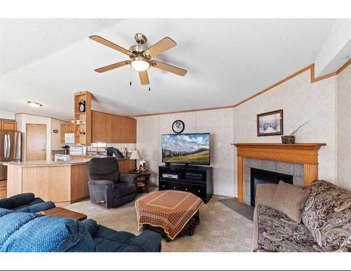 8902 91 Street, Grande Prairie, AB - Indoor Photo Showing Living Room With Fireplace