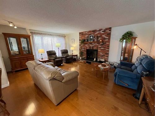 9705 103 Street, Nampa, AB - Indoor Photo Showing Living Room With Fireplace