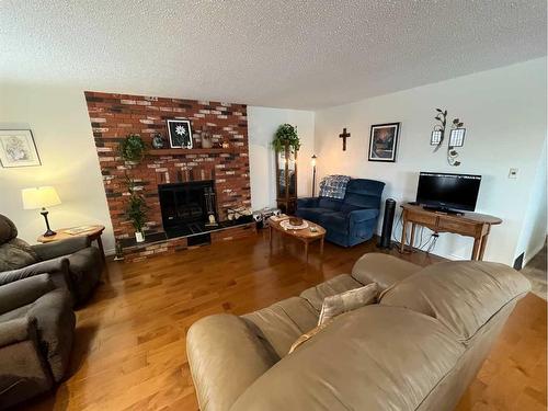 9705 103 Street, Nampa, AB - Indoor Photo Showing Living Room With Fireplace