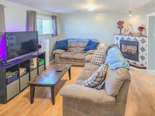 9705 105Th Street, Grande Cache, AB - Indoor Photo Showing Living Room With Fireplace