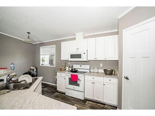 4616 50 Street, Rycroft, AB - Indoor Photo Showing Kitchen With Double Sink