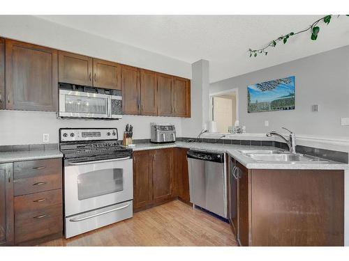 101-11230 104 Avenue, Grande Prairie, AB - Indoor Photo Showing Kitchen With Double Sink