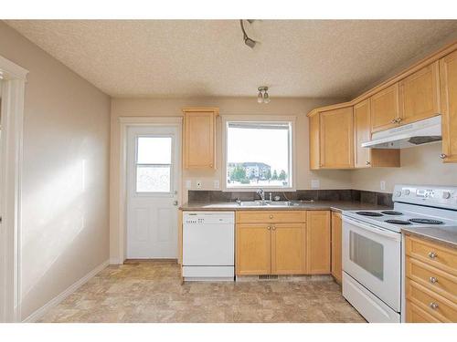 6907 112 Street, Grande Prairie, AB - Indoor Photo Showing Kitchen With Double Sink