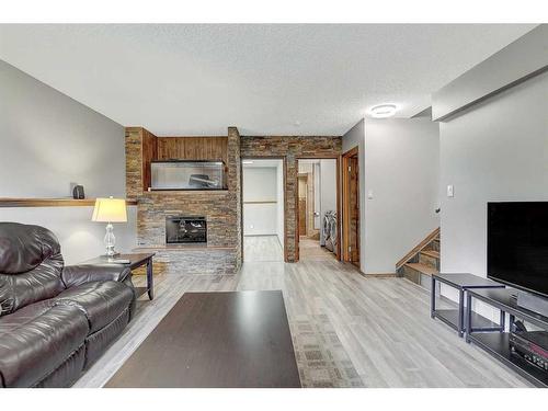 8930 103 Avenue, Grande Prairie, AB - Indoor Photo Showing Living Room With Fireplace