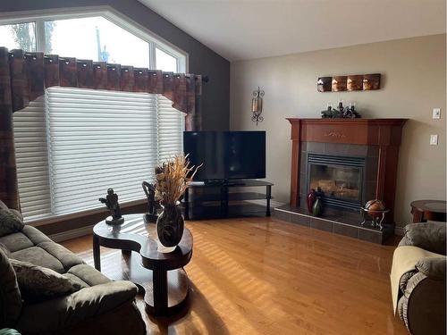 11207 110 Ave. Close, Fairview, AB - Indoor Photo Showing Living Room With Fireplace