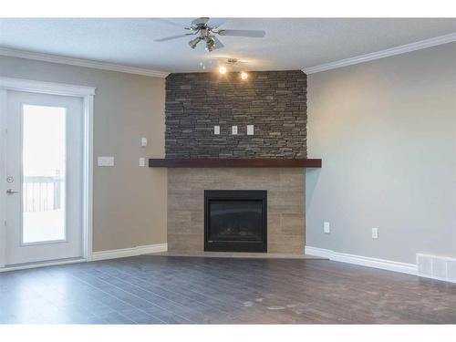 5215 52 Street, Valleyview, AB - Indoor Photo Showing Living Room With Fireplace