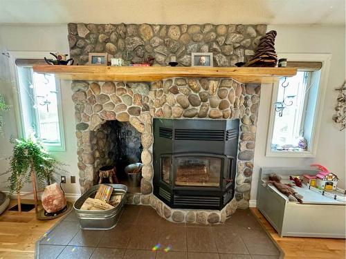 13502-790 Township Road, Rural Saddle Hills County, AB - Indoor Photo Showing Living Room With Fireplace