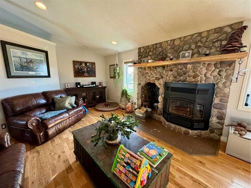 13502-790 Township Road, Rural Saddle Hills County, AB - Indoor Photo Showing Living Room With Fireplace