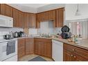 403-9221 Lakeland Drive, Grande Prairie, AB  - Indoor Photo Showing Kitchen With Double Sink 