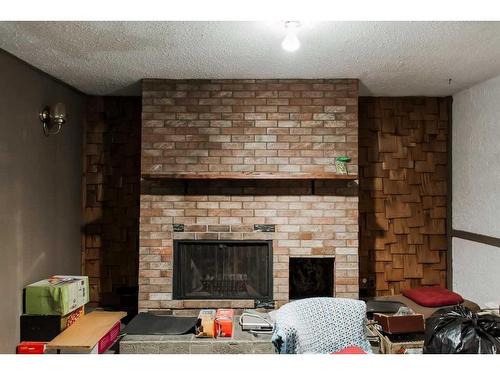 10506 101 Avenue, Grande Prairie, AB - Indoor Photo Showing Living Room With Fireplace