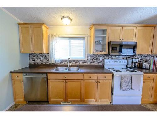 8806 85 Avenue, Grande Prairie, AB - Indoor Photo Showing Kitchen With Double Sink