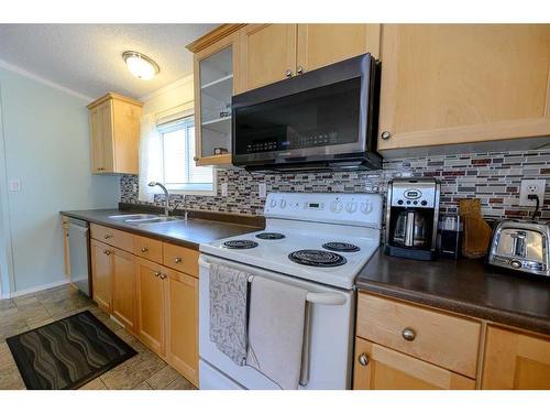 8806 85 Avenue, Grande Prairie, AB - Indoor Photo Showing Kitchen With Double Sink