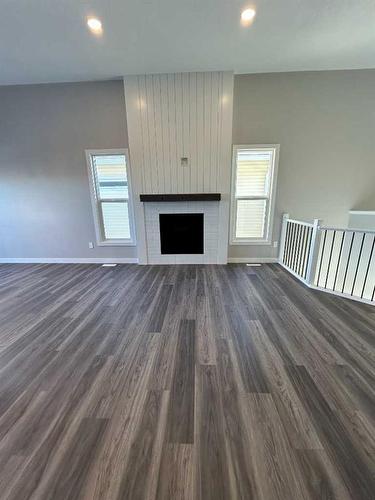 11314 107 Avenue, Grande Prairie, AB - Indoor Photo Showing Living Room With Fireplace