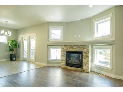 10609 113 Street, Grande Prairie, AB - Indoor Photo Showing Living Room With Fireplace