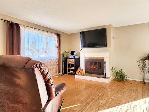 10202 97 Avenue, Grande Cache, AB - Indoor Photo Showing Living Room With Fireplace