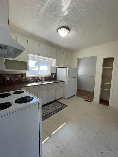 5015 52Nd Avenue, High Prairie, AB - Indoor Photo Showing Kitchen With Double Sink