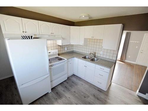 9230 100 Avenue, Grande Prairie, AB - Indoor Photo Showing Kitchen With Double Sink