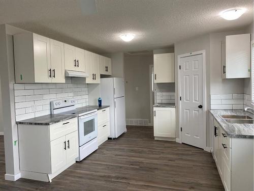 9406 102 Avenue, Grande Prairie, AB - Indoor Photo Showing Kitchen With Double Sink