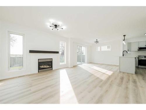 9813 90 Street, Grande Prairie, AB - Indoor Photo Showing Living Room With Fireplace