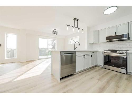 9813 90 Street, Grande Prairie, AB - Indoor Photo Showing Kitchen With Stainless Steel Kitchen