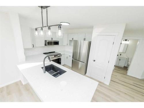 9813 90 Street, Grande Prairie, AB - Indoor Photo Showing Kitchen With Stainless Steel Kitchen With Double Sink With Upgraded Kitchen