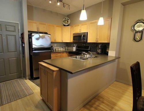 402-12330 102 Street, Grande Prairie, AB - Indoor Photo Showing Kitchen With Double Sink