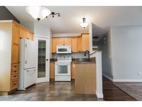 11334 Pinnacle Drive, Grande Prairie, AB - Indoor Photo Showing Kitchen