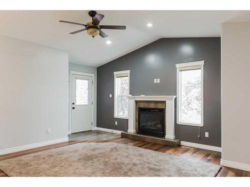 11334 Pinnacle Drive, Grande Prairie, AB - Indoor Photo Showing Living Room With Fireplace