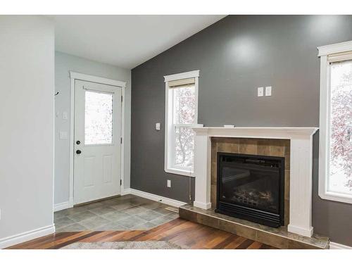 11334 Pinnacle Drive, Grande Prairie, AB - Indoor Photo Showing Living Room With Fireplace