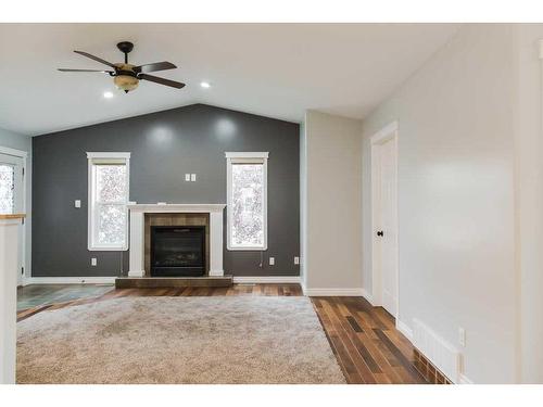 11334 Pinnacle Drive, Grande Prairie, AB - Indoor Photo Showing Living Room With Fireplace