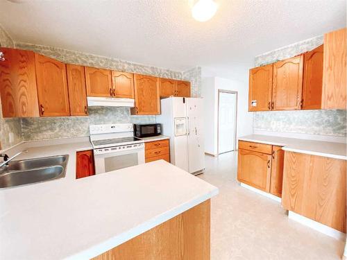 4535 46 Street, Rycroft, AB - Indoor Photo Showing Kitchen With Double Sink