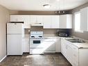 10602 103 Street, Grande Prairie, AB  - Indoor Photo Showing Kitchen With Double Sink 