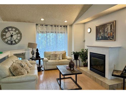 11401 69 Avenue, Grande Prairie, AB - Indoor Photo Showing Living Room With Fireplace