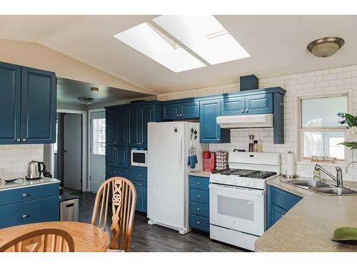 91048/91054 Township Road 704, Wembley, AB - Indoor Photo Showing Kitchen With Double Sink