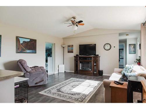 91048/91054 Township Road 704, Wembley, AB - Indoor Photo Showing Living Room With Fireplace