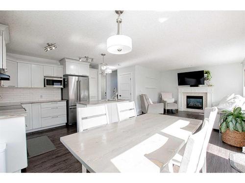 10213 125 Avenue, Grande Prairie, AB - Indoor Photo Showing Kitchen With Fireplace With Stainless Steel Kitchen