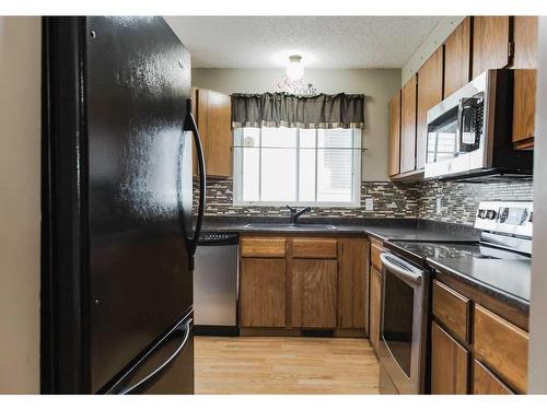 10210 91 Street, Grande Prairie, AB - Indoor Photo Showing Kitchen With Stainless Steel Kitchen With Double Sink