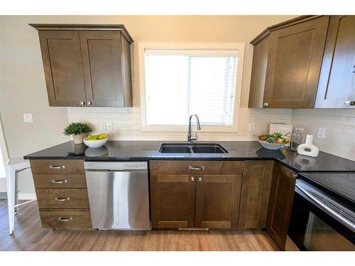 11338 59 Avenue, Grande Prairie, AB - Indoor Photo Showing Kitchen With Double Sink