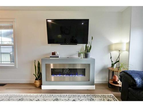 9118 130 Avenue, Peace River, AB - Indoor Photo Showing Living Room With Fireplace