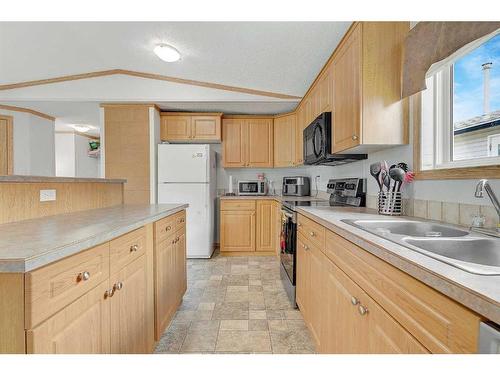 8818 89 Avenue, Grande Prairie, AB - Indoor Photo Showing Kitchen With Double Sink