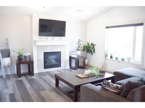 6909 115A Street, Grande Prairie, AB - Indoor Photo Showing Living Room With Fireplace