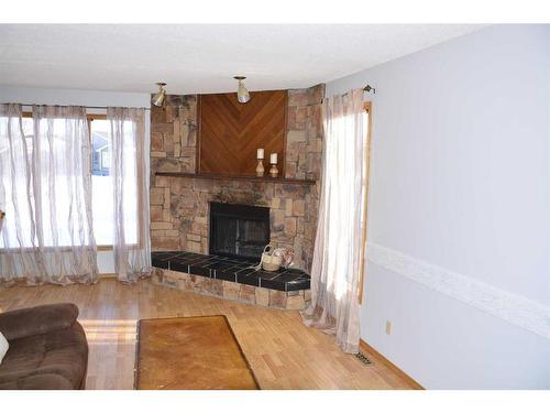 4429 54 Street, Grimshaw, AB - Indoor Photo Showing Living Room With Fireplace